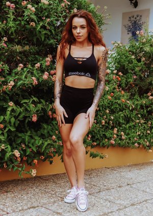 18 year old girl Megan Rain removes her sandals and then clothes to pose naked